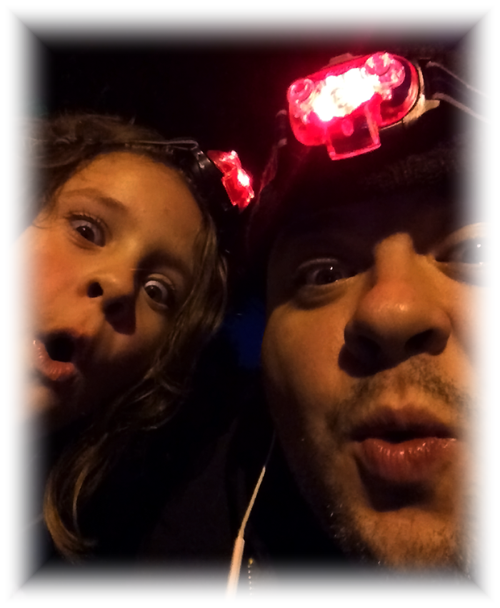 Family photo of a father and daughter sharing a playful moment